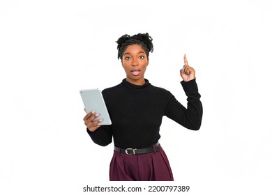 Focused African American Woman In Studio. Female Model In Turtleneck With Curly Hair Using Tablet. Portrait, Emotion, Technology Concept