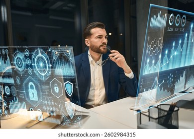 Focused Analyst Reviewing Digital Graphs And Network Security In High-Tech Office Environment