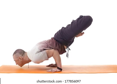 Focused Athletic Man Posing In Difficult Yoga Pose