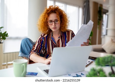 Focused Business Woman Using Laptop At Home, Looking At Screen, Chatting, Reading Or Writing Email, Sitting On Couch, Female Student Doing Homework, Working On Research Project Online