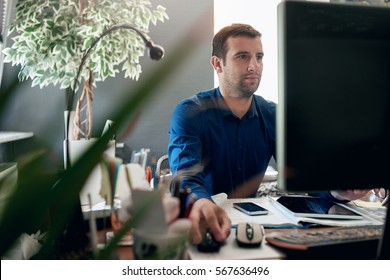 Focused Businessman At Work On Computer In An Office 