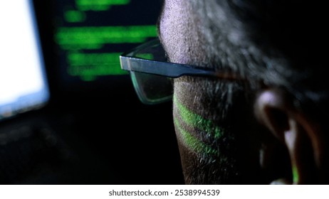 Focused Coder Analyzes Code on Computer Screen in Dark Environment - Cyber security, Cyber Attack, Penetration testing concept.
