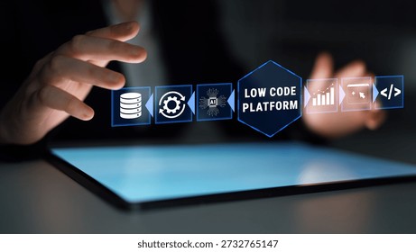 Focused Engagement with Low Code Platform Icons on Touchscreen Device in Modern Workspace Setting, Representing Digital Transformation and Software Development Quark. - Powered by Shutterstock - Get 15% off with code: PIKWIZARD15