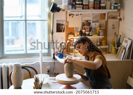 Image, Stock Photo Young woman crafting with paper at a creative workspace