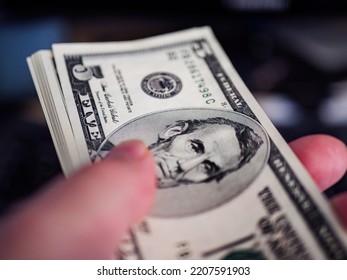 Focused fragment of an five dollar bill for abstract background - Shutterstock ID 2207591903