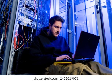 focused hacker data center hacking software system vulnerable cyber security server room technology digital world metaverse