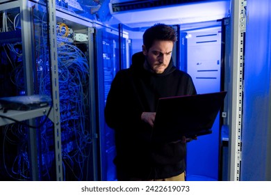 focused hacker data center hacking software system vulnerable cyber security server room technology digital world metaverse