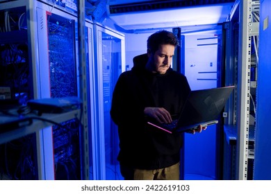focused hacker data center hacking software system vulnerable cyber security server room technology digital world metaverse