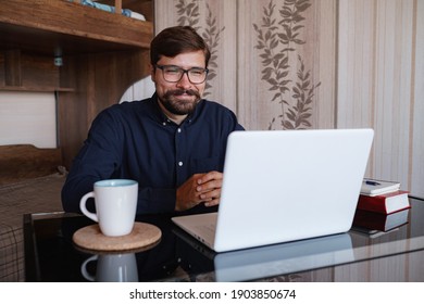 Focused Man Sitting At Desk Watching Webinar Video Course Gain New Knowledge Use On-line Application Website. Manager Talk To Client Provide Professional Help And Support Concept