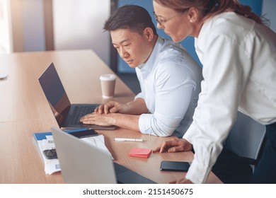 Focused Mature Female Employee Discussing Project, Showing Presentation To Skilled Team Leader. 