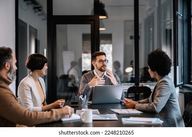 A focused mentor is explaining project to mentees at the boardroom at enterprise. - Shutterstock ID 2248210265