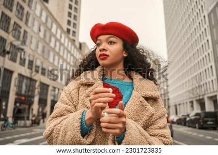 Focused multiracial woman preparing inserts earphones during walking