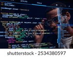 Focused Programmer Analyzing Code on Computer Screen