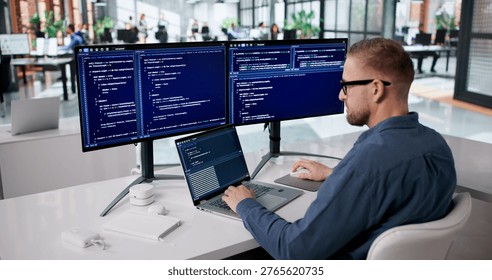 Focused Programmer Developing Innovative Software At His Workspace