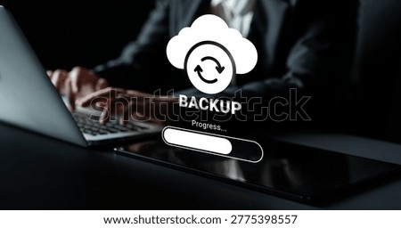 A focused scene depicting a cloud backup process with hands typing on a laptop, showcasing technology and data protection in a modern workspace setting. Ledger