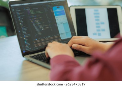 A focused software engineer developing a mobile application in a sleek, modern tech environment — perfect for illustrating coding, cybersecurity, and tech innovation.