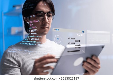 A focused software engineer reviews code on tablet, surrounded by projected coding elements. scene highlights dedication of developer in tech driven environment. coding developer software engineer