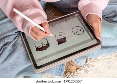 Focused Stylish Teenage Girl Painting Using Apple Pencil On IPad Tablet And Watching Online Course On Phone While Practicing At Home. Online Training, Online Classes. Russia, Tatarstan, June 15, 2021.