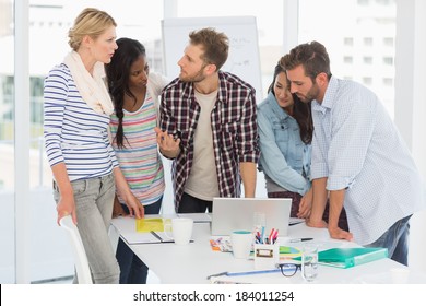 Focused Team Of Designers Having A Meeting In Creative Office