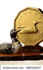 A Focused Theme On The Canadian Dollar Currency With A Loonie Coin Used In The Everyday Money Supply.