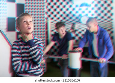 Focused Tween Boy Visiting Quest Room With Family, Thinking About Solving Conundrum. Toned Image With Glitch Effect