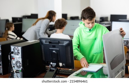 Focused Tween Schoolboy Using Copier To Make Copy Of Lecture Note In College Computer Class. Modern Technologies In Teaching Children ..