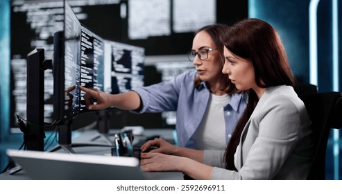 Focused Woman Programmer Developing Software Code On Computer Screen In Office.