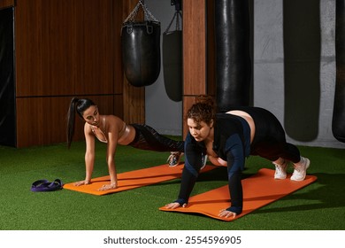 Focused women perform push ups on mats in a vibrant gym environment filled with equipment. - Powered by Shutterstock