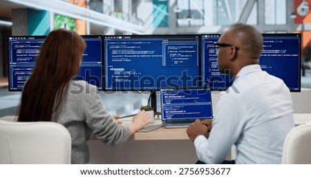 Focused Young Programmers Coding On Computers, Collaborating In Office Meeting. Agile Software Developers Analyze Data