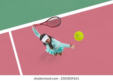 Focused young woman, tennis player in motion on court, serving ball with racket showing skills and determination. Top view. Concept of sport, active and healthy lifestyle, tournament - Powered by Shutterstock