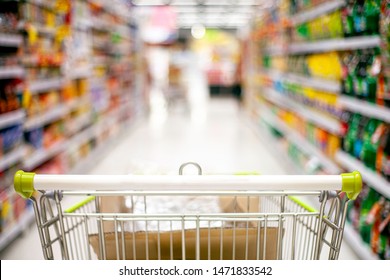 Focusing trolley in supermarket and blur product