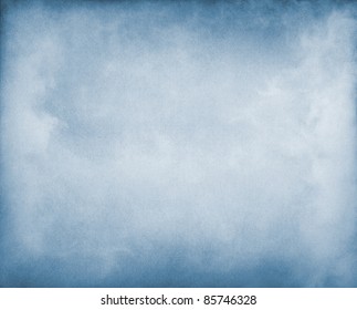 Fog And Clouds On A Blue Paper Background.  Image Displays A Pleasing Paper Grain And Texture At 100%.