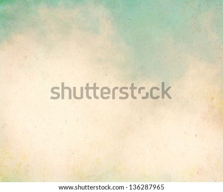 Fog and clouds on a textured, vintage paper background with grunge stains.  Image displays a pleasing grain texture at 100%.