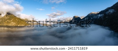 Fog Covered Canadian Landscape in Sea to Sky, Squamish, BC, Canada. Sunny Winter Aerial Panorama Background.