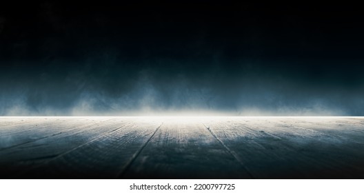 Fog in the dark. Smoke and mist on a wooden table.  Abstract Halloween background. - Shutterstock ID 2200797725