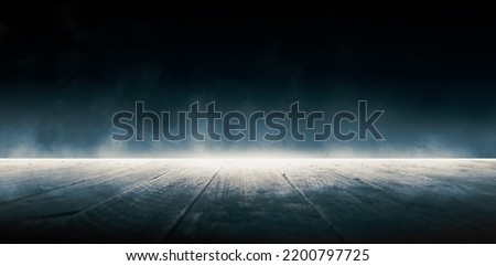 Fog in the dark. Smoke and mist on a wooden table.  Abstract Halloween background.