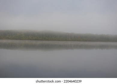 Fog In The Early Morning Over A Manitoba Lake