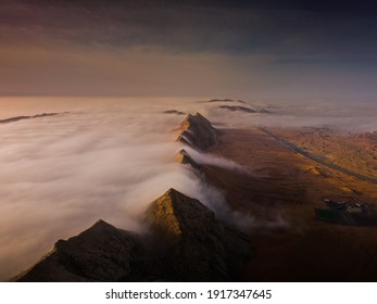 fog , fogy morning between mountains and deser from maliha sharjah desert - Powered by Shutterstock