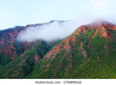 Fog Lifting From Beautiful Mountain Top.