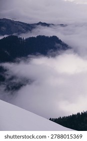 fog in the mountains. Clouds envelop the mountain peaks
