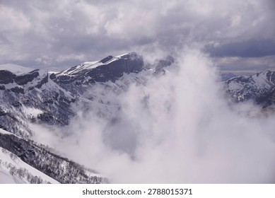 fog in the mountains. Clouds envelop the mountain peaks
