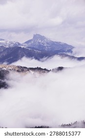 fog in the mountains. Clouds envelop the mountain peaks