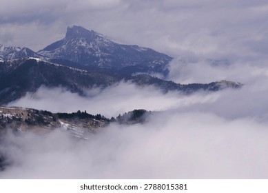 fog in the mountains. Clouds envelop the mountain peaks
