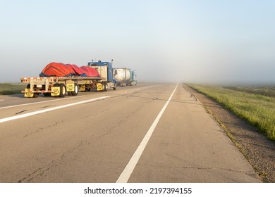 fog on the road. trucks on hiway 