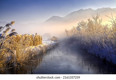 Fog over the winter river in the early morning. Winter river in morning fog. Fog on winter river. Winter snow scene in fog - Shutterstock ID 2161337259