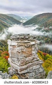 Fog rolls into the valley below Lindy Point on an autumn evening at Blackwater Falls State Park near Davis, West Virginia.