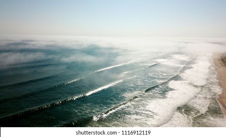 Fog Rolls In With The Waves In Southampton, NY