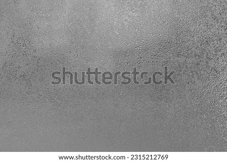 fogged transparent glass close-up in the form of a frosted background