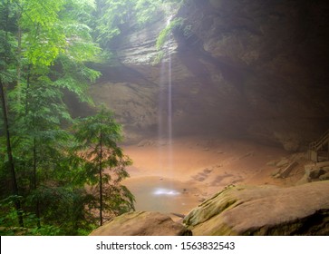 Foggy Ash Cave with a tall, misty waterfall