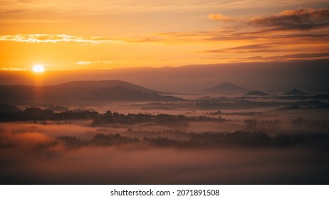 Foggy autumn sunrise with sleeping village - Powered by Shutterstock